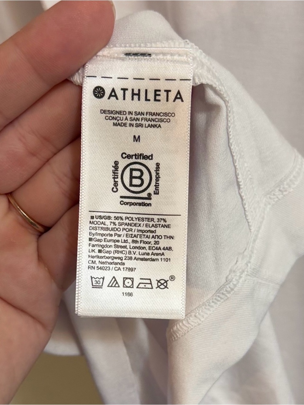 Athleta Hi-Low Asymmetrical V-Neck White Short Sleeve Athletic Top | M - Picture 9 of 12